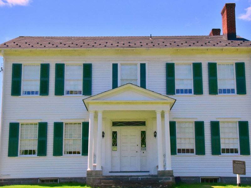 The Laporte House, a historic white house with green shutters
