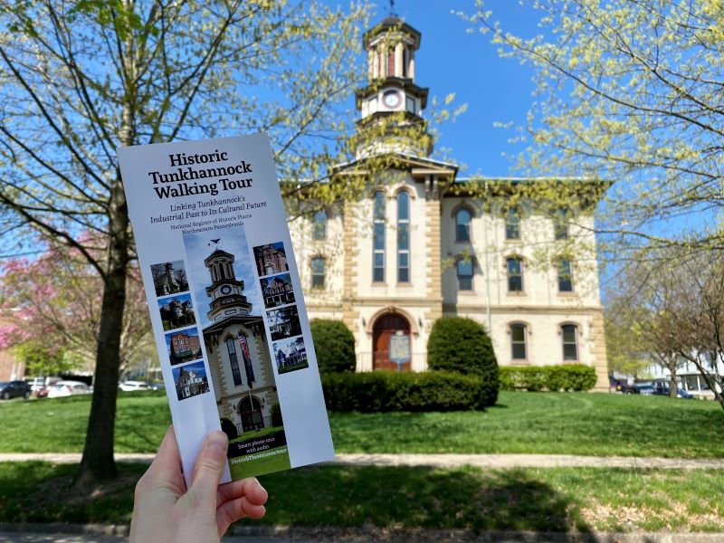 Historic Tunkhannock Walking Tour brochure with the Wyoming County Courthouse in the background