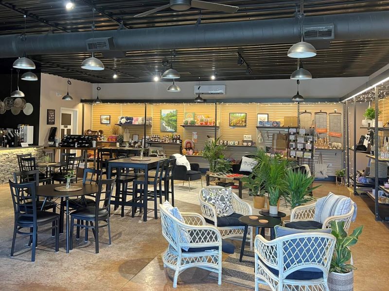 Tables and chairs inside Unwind Cafe and Market