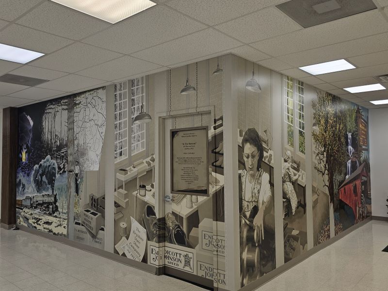 A mural featuring Sullivan County's history, including railroading, the shoe factory, and waterfalls.