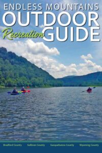 Outdoor recreation guide booklet with a picture of kayakers on the cover